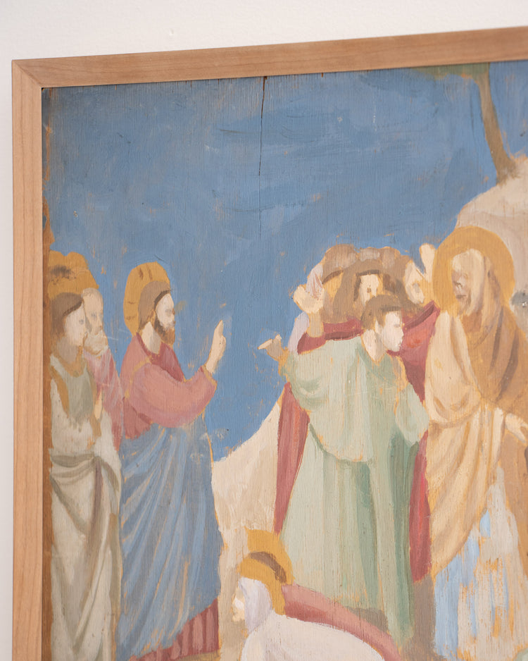 Framed artwork depicting a religious scene with figures in colorful robes against a blue sky.