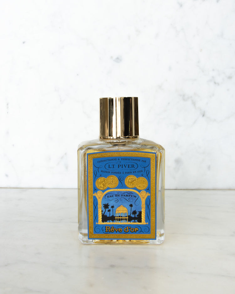 Perfume bottle with blue label on a white background