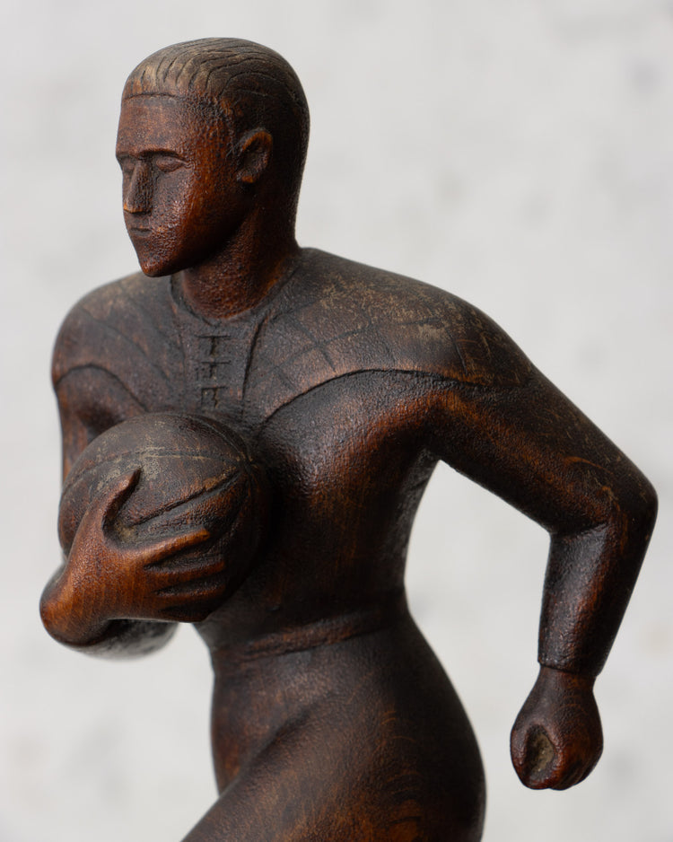 Carved Wooden Rugby Player