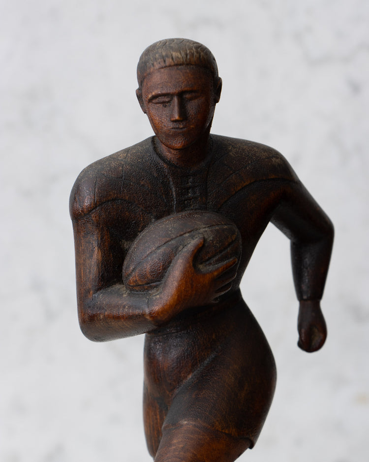 Carved Wooden Rugby Player